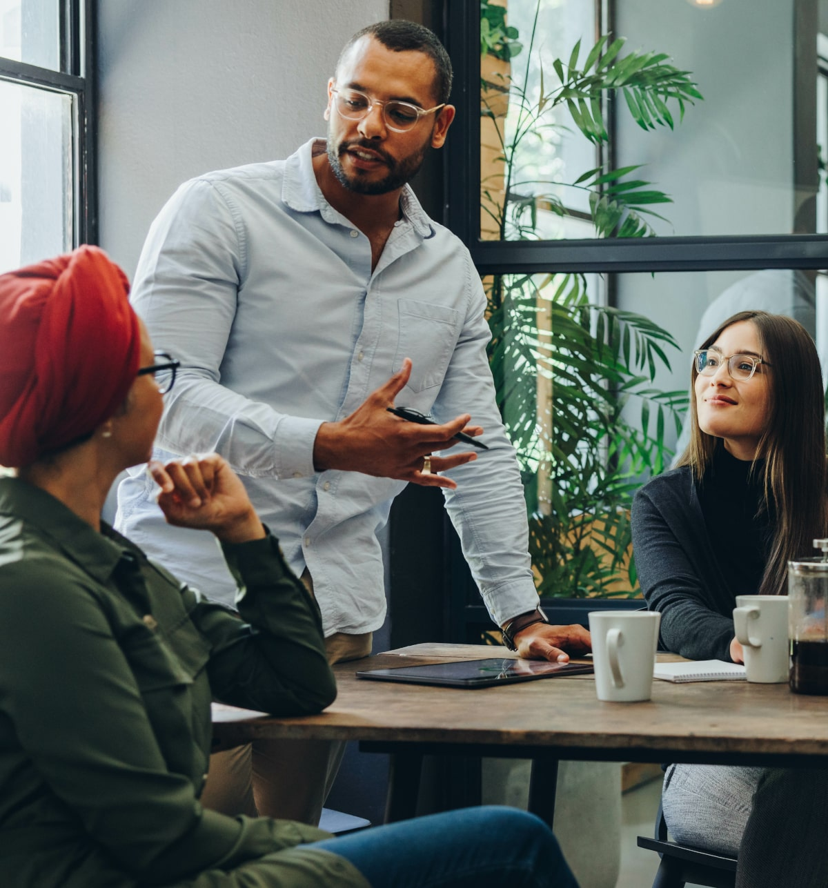 Colleagues exchanging ideas around a meeting table