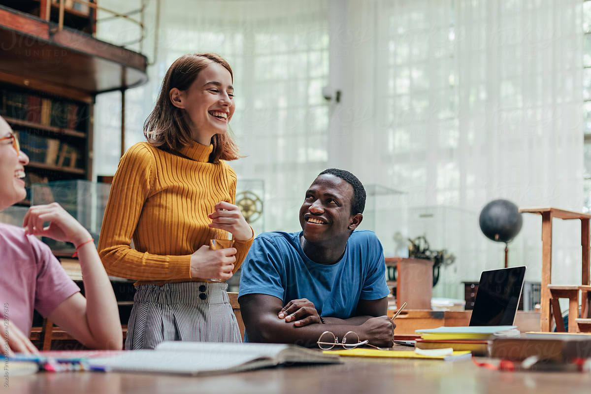 A diverse team sharing ideas in a bright workspace