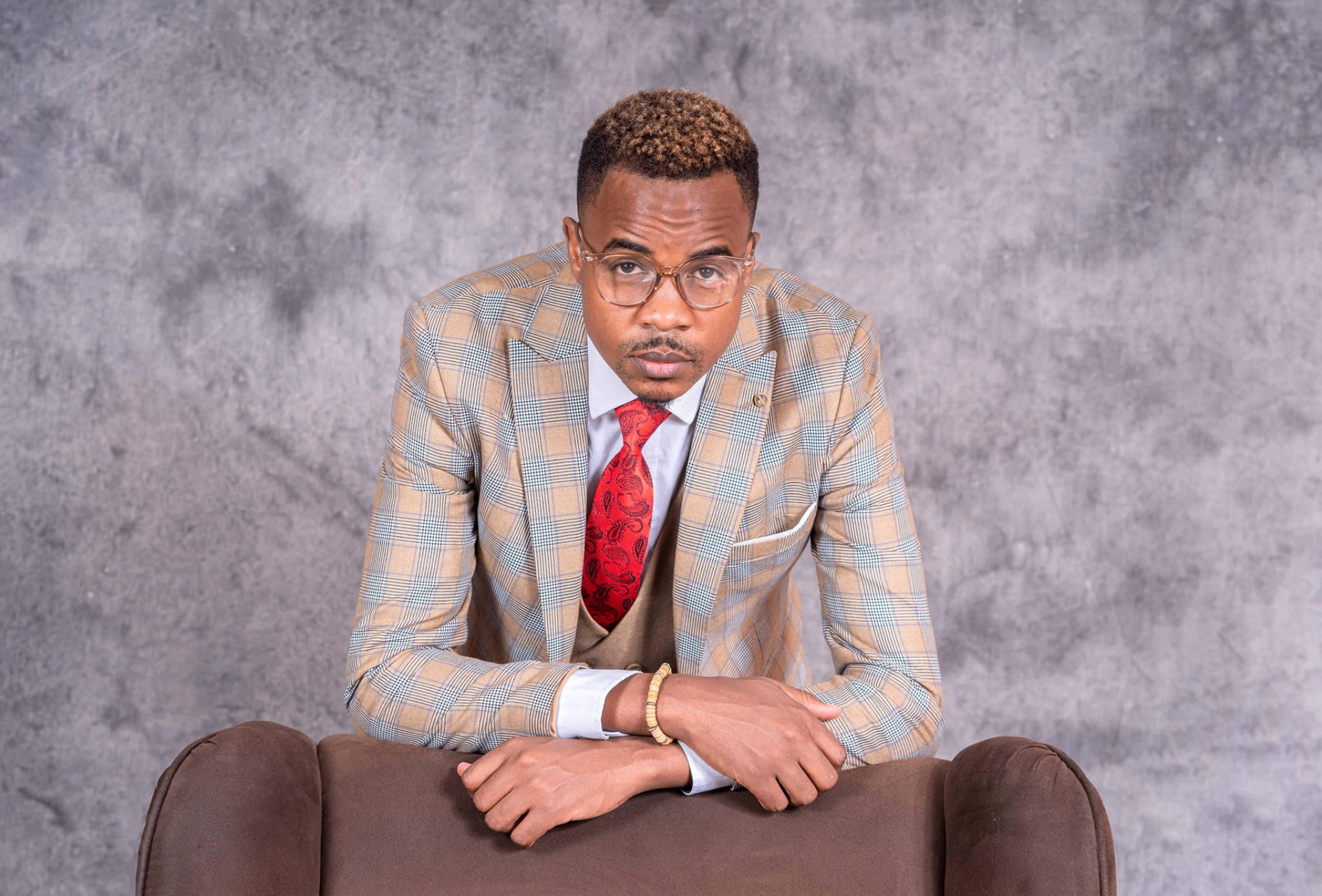 Tanya Freejoy Jeriel portrait in checked suit